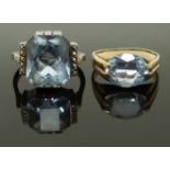 A 9ct gold ring set with an aquamarine and a silver ring with blue topaz, size G & I