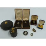 Two Wedgwood silver gilt pendants and brooches set with black basalt cameos, silver Wedgwood