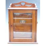 Glazed Art Nouveau mahogany smoker's cabinet with fitted interior including a revolving lower