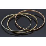 A 9ct gold tri-coloured bangle made up of three linked bangles, 9.4g