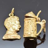 An 18ct gold charm in the form of a stein (3.3g) and a 14k gold charm in the form of Strauss (3.9g)