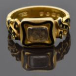 Victorian 18ct gold ring set with plaited hair to the central glass compartment surrounded by a