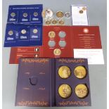 Various historic Royal commemorative gold plated crowns to include House of Tudor, House of Windsor,