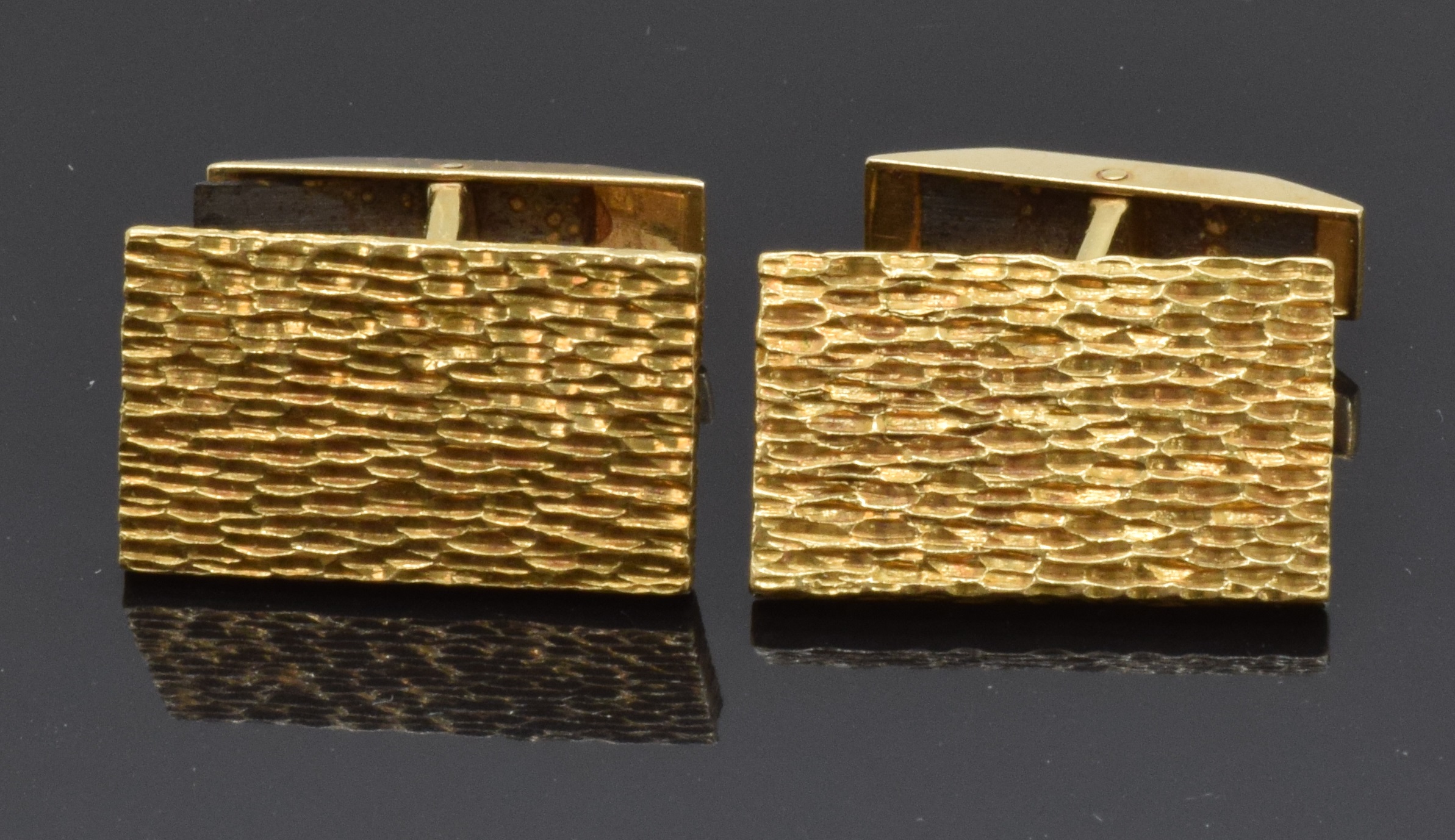 A pair of 18ct gold cufflinks with textured detail, 21.4g