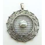 Arts and Crafts silver pendant with lattice and foliate decoration set with a pearl, 3.8cm diam