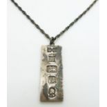 A hallmarked silver ingot pendant on silver chain