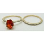 A 9ct gold ring set with an oval cut Salamanca fire opal and white sapphires and a matching half