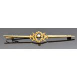 French 18ct gold brooch set with a pearl surrounded by a foliate border, 4.3g