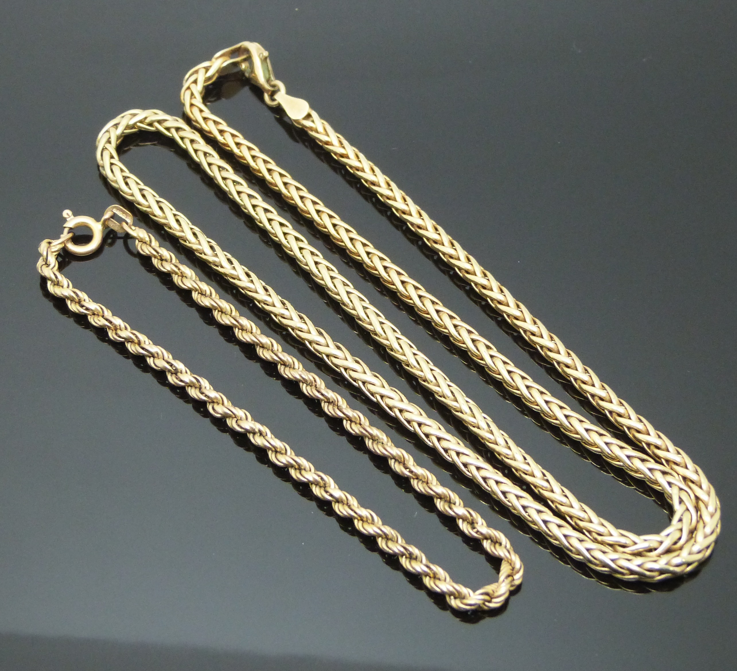 A 9ct gold necklace and 9ct gold rope twist bracelet, 10.7g