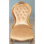19thC mahogany framed button back nursing chair raised on gnurled cabriole legs