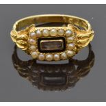 William IV 18ct gold mourning ring set with hair in a glass compartment surrounded by seed pearls,