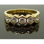 An 18ct gold ring set with five cubic zirconia, size Q, 5.29g