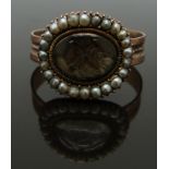 Georgian / Victorian mourning ring set with plaited hair surrounded by seed pearls, size Q/R, 3.54g