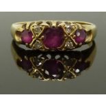 An 18ct gold ring set with rubies and diamonds, size K, 3.00g