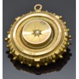 Victorian mourning brooch set with a pearl to the centre, verso a glass compartment, 2.7cm diameter,