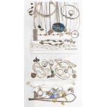 A collection of silver jewellery including ingot, bangles, earrings, bracelets, rings, etc