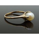 A 9ct gold ring set with a pearl in a claw setting, size S, 3g