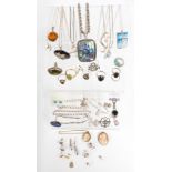 A collection of silver jewellery including abalone pendant, six silver rings, earrings, four