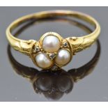 Victorian yellow metal ring set with split pearls and old cut diamonds in the form of a clover, size