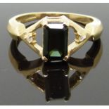 A 9ct gold ring set with an emerald cut tourmaline and diamonds, size M/N, 3.36g