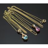 Two 9ct gold pendants, one set with an oval cut topaz and one pear cut pink sapphire and a