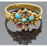An early Victorian ring set with turquoise, topaz and quartz, with a pierced and filigree decoration