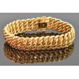 An 18ct gold bracelet made up of rope twist links, with six spare links, 50.8g