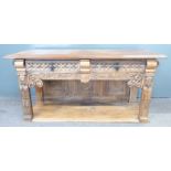 French 19th/20thC oak low table with two drawers, undershelf and carved figural decoration either