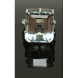 An 18ct white gold ring set with an emerald cut aquamarine of approximately 25ct, size P, 9.76g