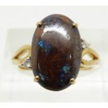 A 9ct gold ring set with a large boulder opal, 3.8g, size N