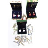 Three sets of novelty cufflinks and 20 keyrings made from rifle cartridges/ bullets.