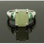 A 9ct white gold ring set with a hardstone and emeralds, size J, 3.09g