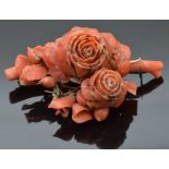Victorian carved coral brooch in the form of roses, 7 x 4cm