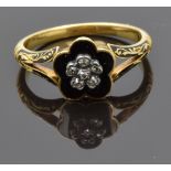 Victorian 18ct gold ring set with black enamel and old cut diamonds in a flower setting, verso a