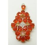 A 9ct gold pendant set with pear cut fire opals and diamonds, 4.4g