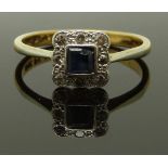 An 18ct gold and platinum ring set with a square cut sapphire and diamonds, size N, 2.74g