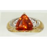 A 9ct gold ring set with a trilliant cut fire opal and diamonds, 3g, size N