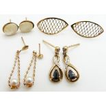 A pair of 9ct gold earrings set with a sapphire and diamonds, a pair of 9ct gold earrings set with