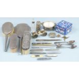 Hallmarked silver dressing table items comprising hand mirror and four brushes, Chinese white