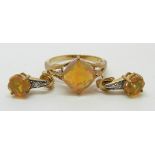 A 9ct gold ring set with a cushion cut Indonesian opal and diamonds (size N) and a pair of