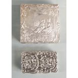 Two modern hallmarked silver trinket boxes, both with embossed decoration, one depicting a