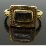 Victorian 18ct gold mourning ring set with plaited hair and wire initials to the central glass