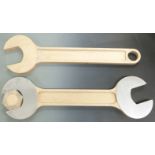 Large novelty wood and aluminium spanner with nut in jaws together with another novelty wooden