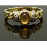 A 9ct gold ring set with a citrine and diamonds, size N, 1.86g