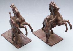 Pair of spelter figures of rearing horses with their handlers, height 25cm