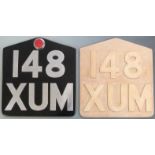 Aluminium novelty oversized motorcycle number plate, height 35cm together with a wooden casting