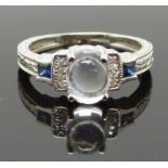 A 14k white gold ring set with a moonstone, sapphires and diamonds, size L/M, 3.17g