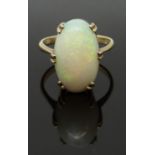 A 9ct gold ring set with a large opal cabochon, size L/M, 4.22g