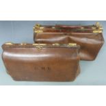 Two vintage brown leather Gladstone bags with brass fittings, largest 22 x 45cm