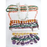 A collection of necklaces including beaded fluorite, aquamarine made up of natural uncut